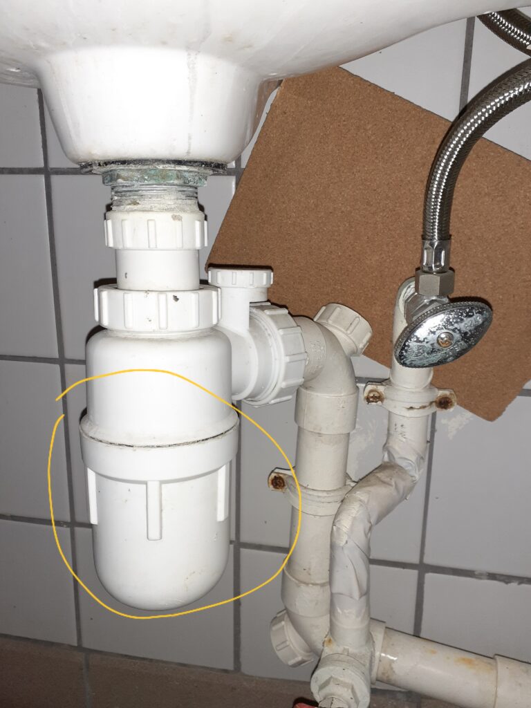 Bottle traps under a wash hand basin