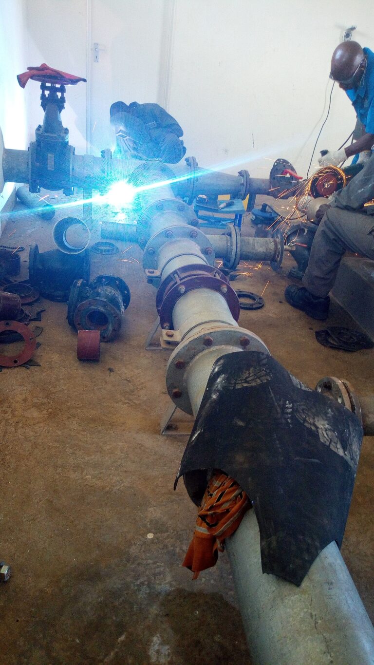 Water pump and motor being installed