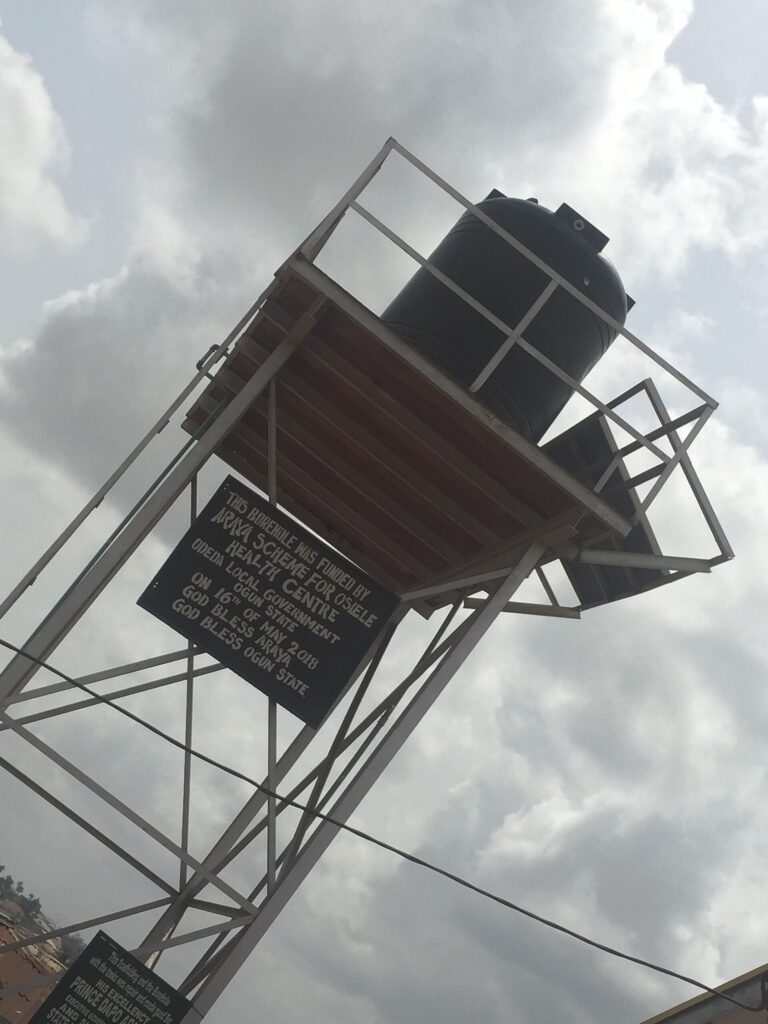 Elevated steel water storage tank on a tower against the sky